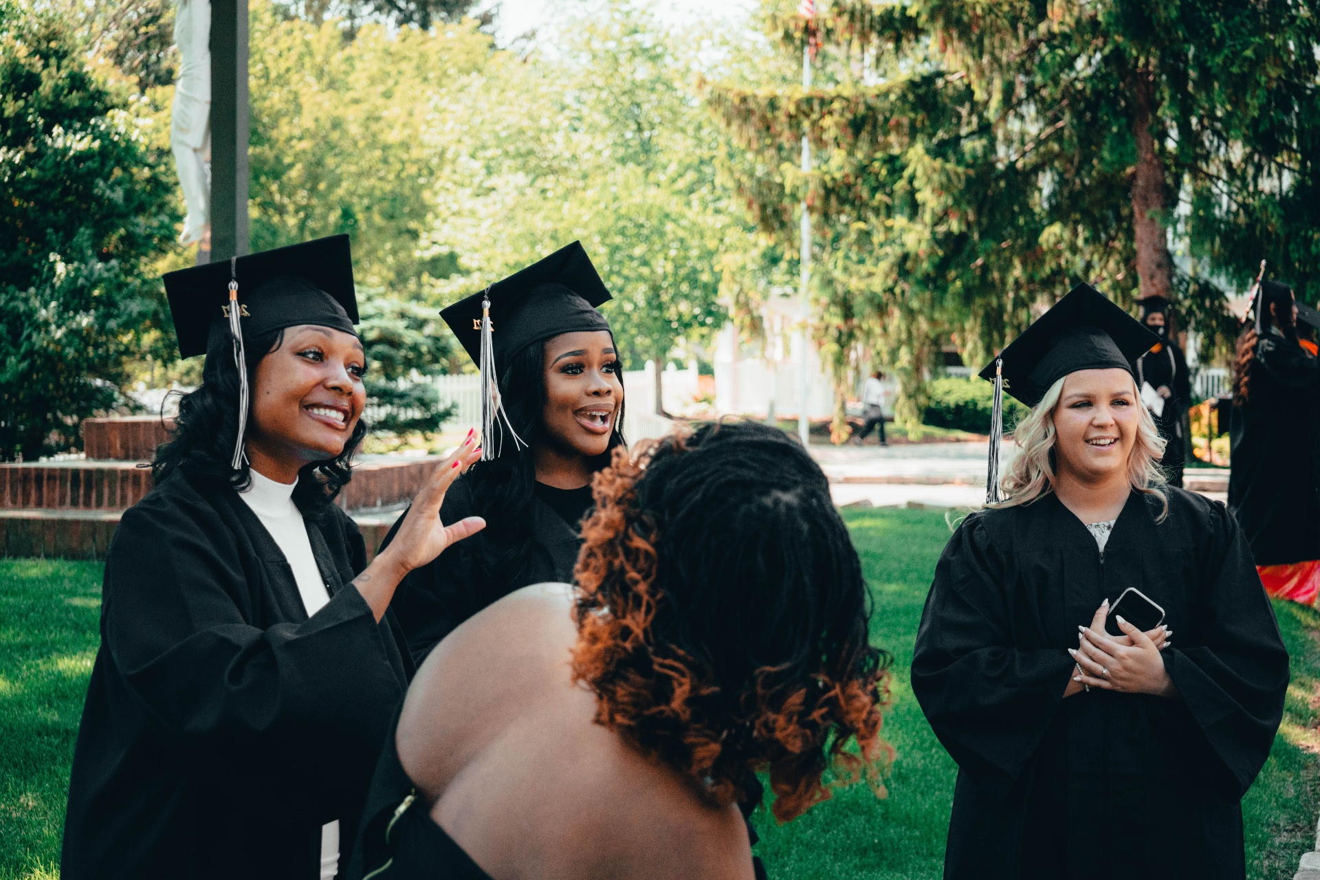 Diverse students celebrating scholarship acceptance letters